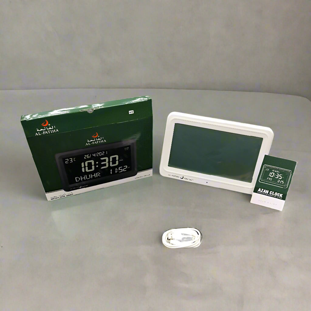 Digital prayer time display with packaging on a textured surface