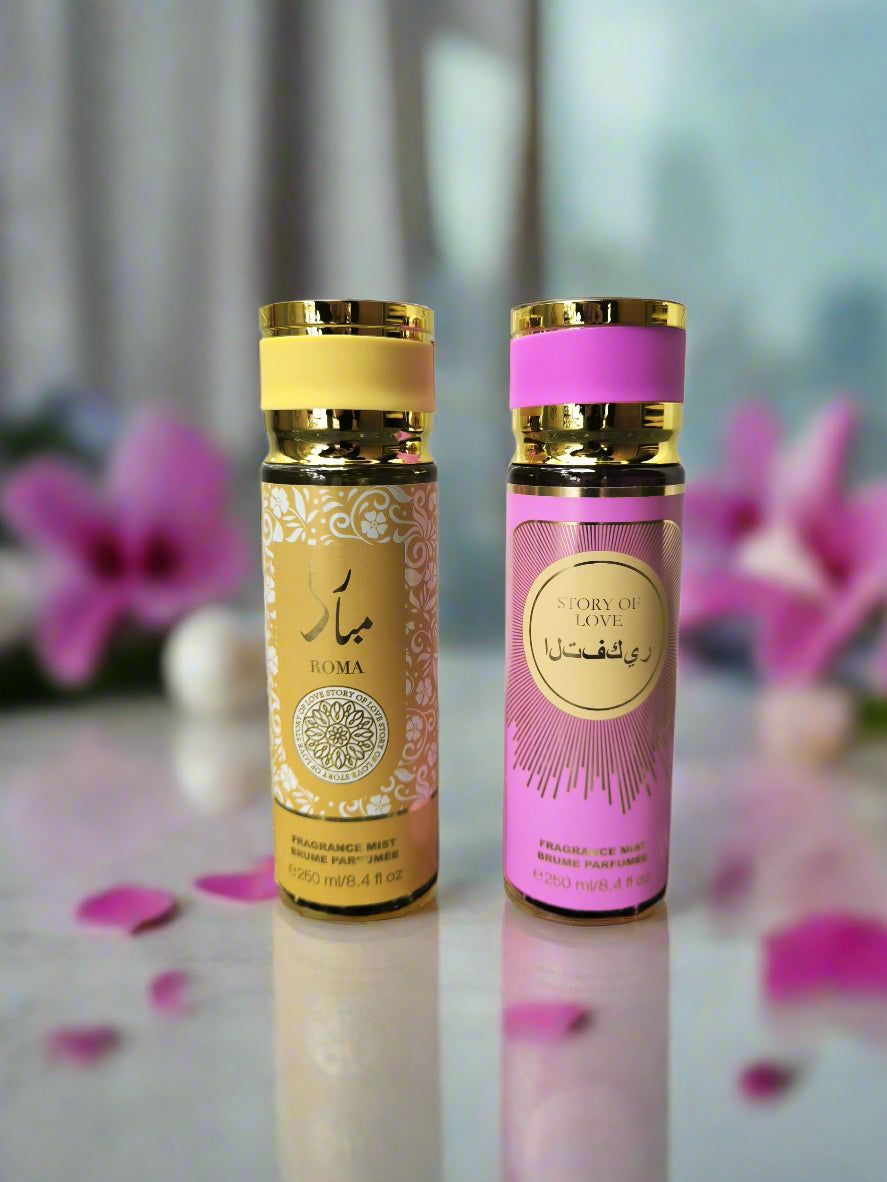 Two perfume bottles, one gold and one pink, on a gray surface with a tiled wall background.