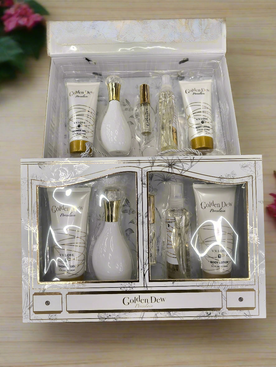 Set of skincare products in a decorative box labeled 'Golden Dew' on a textured surface.