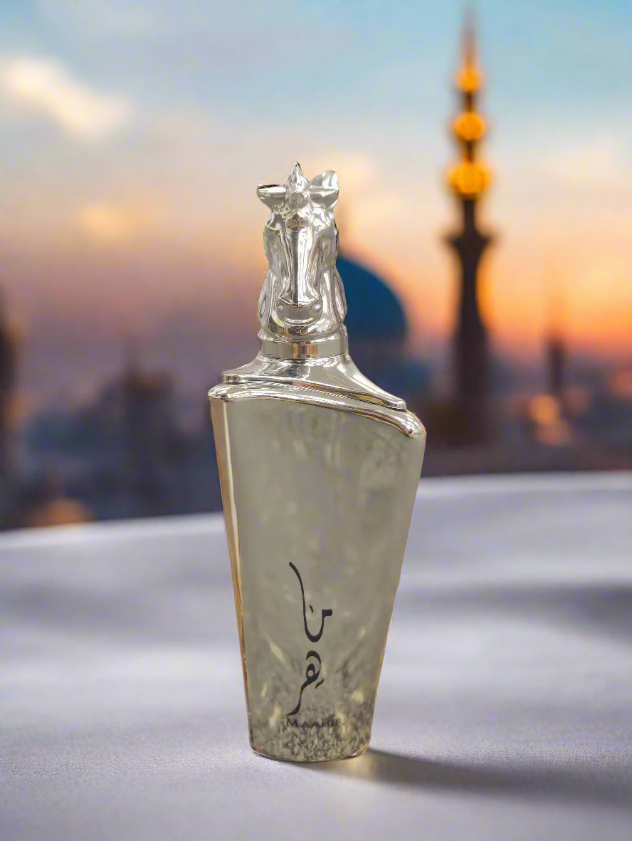 Silver horse-shaped decanter on a wooden surface with a blurred background