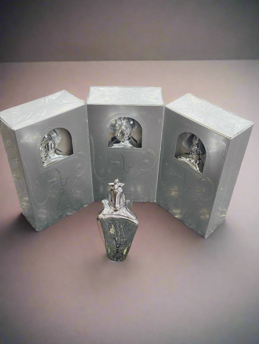 Three box packed silver colour perfumes with a one open silver colour horse faced perfume at front.