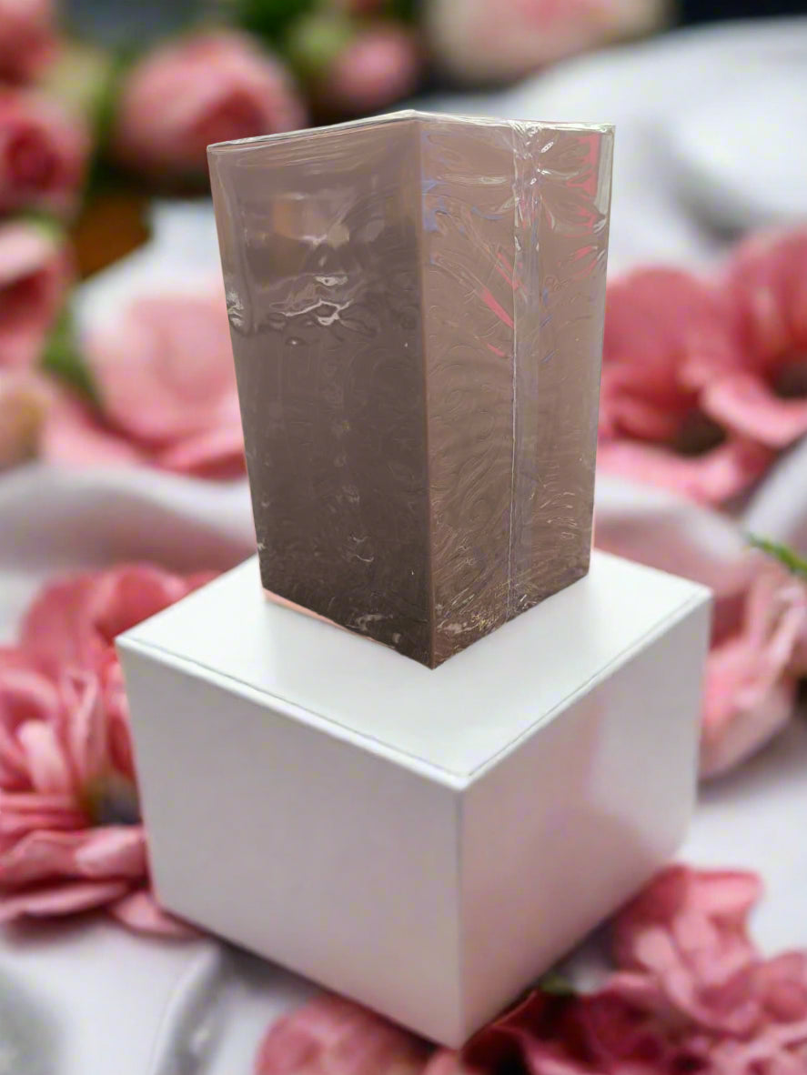Brown rectangular block on a textured surface with blurred background