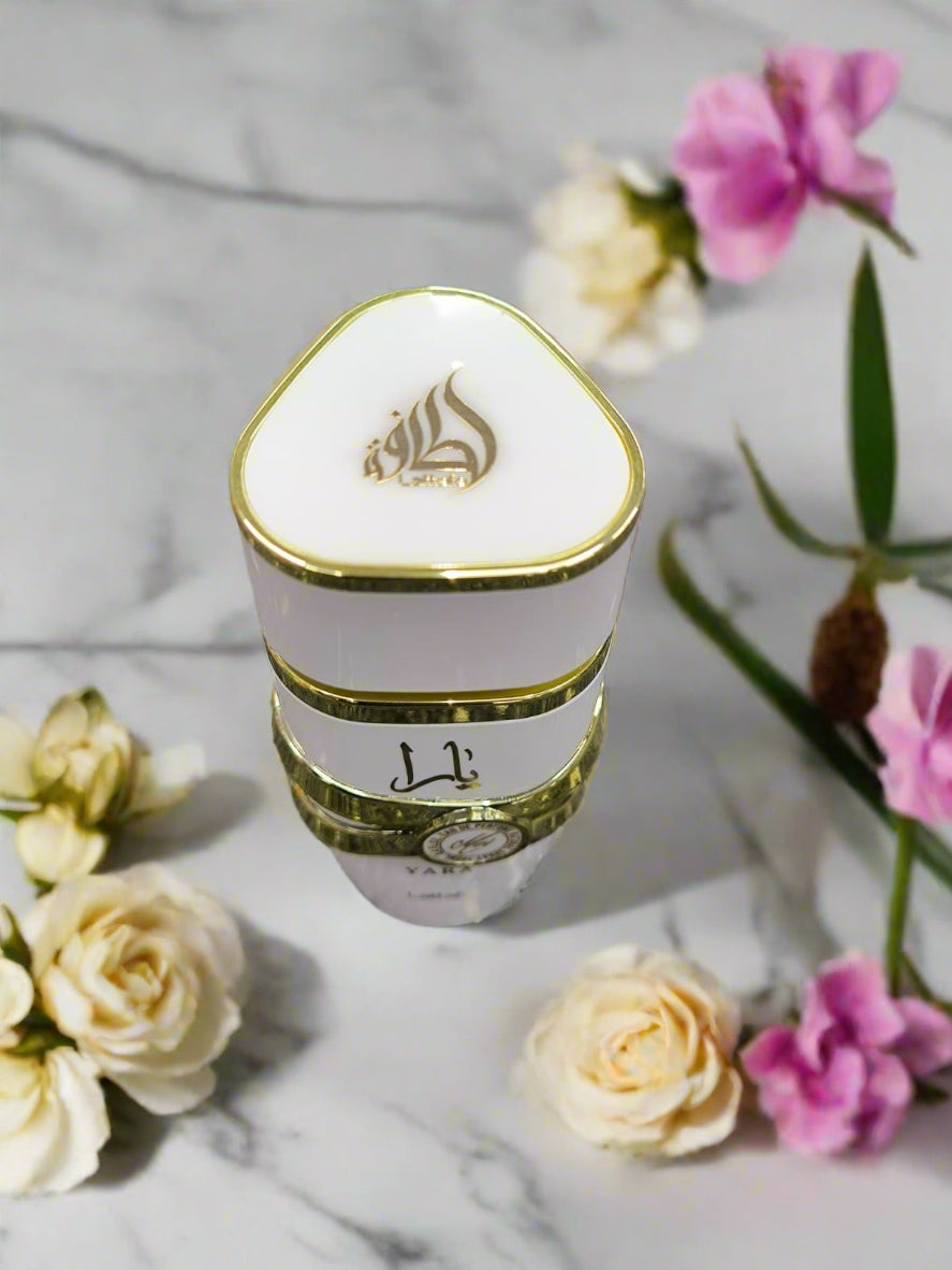 Triangular white container with gold accents on a textured gray surface