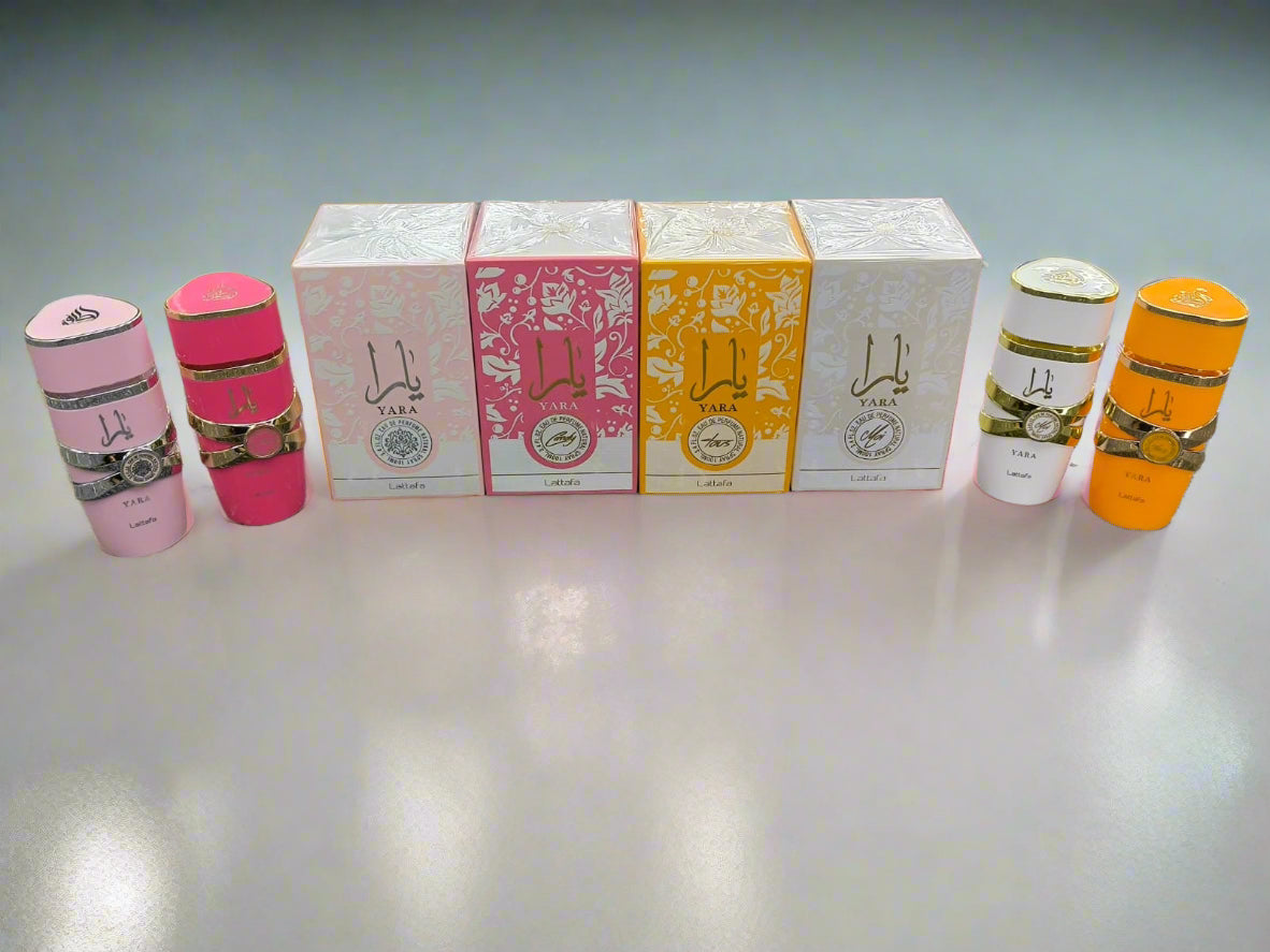 Set of small containers and boxes on a textured surface