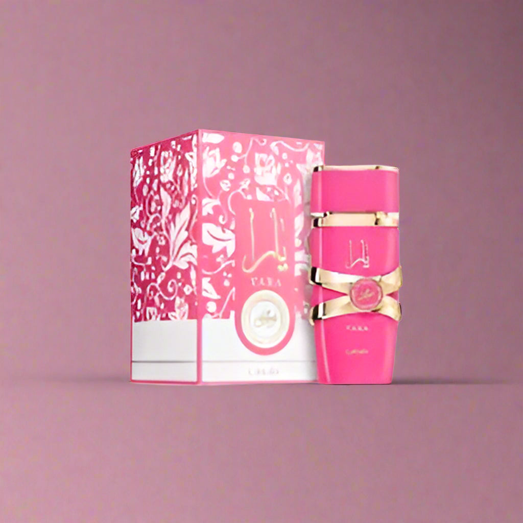 Pink perfume bottle with decorative packaging on a white background