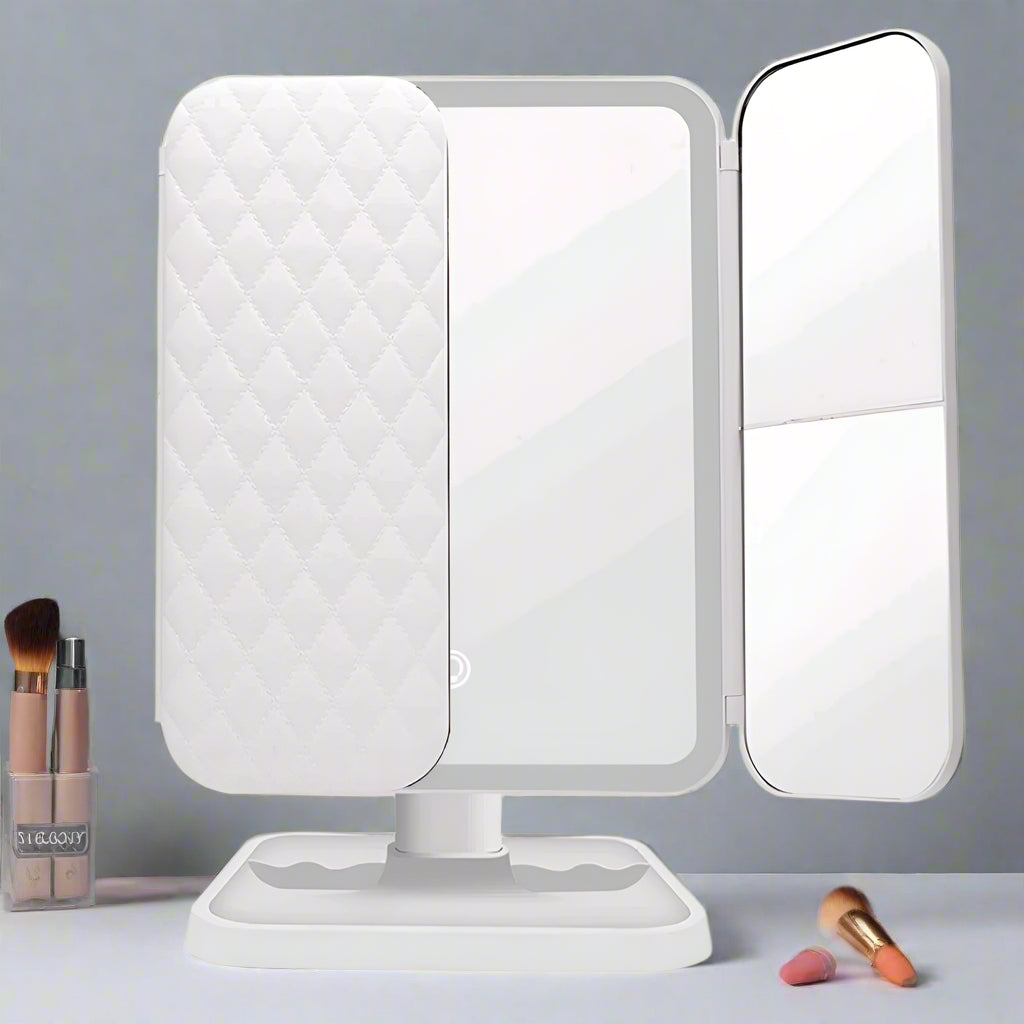 White makeup mirror with a quilted design on the left side against a white background