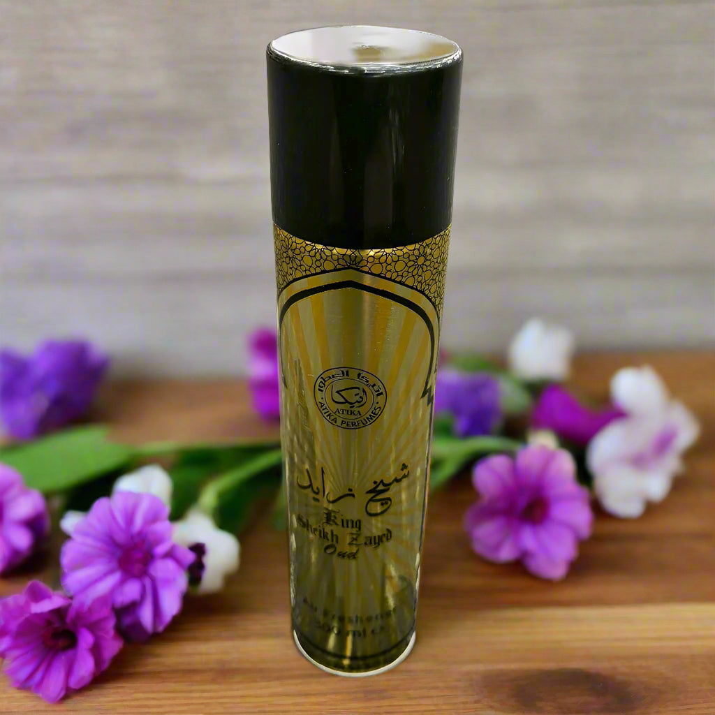Gold and black cylindrical product on a textured gray background