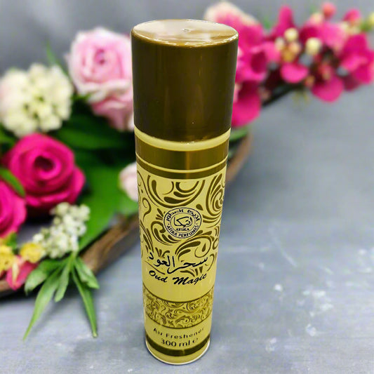 Perfume bottle with gold and black design on a textured gray background