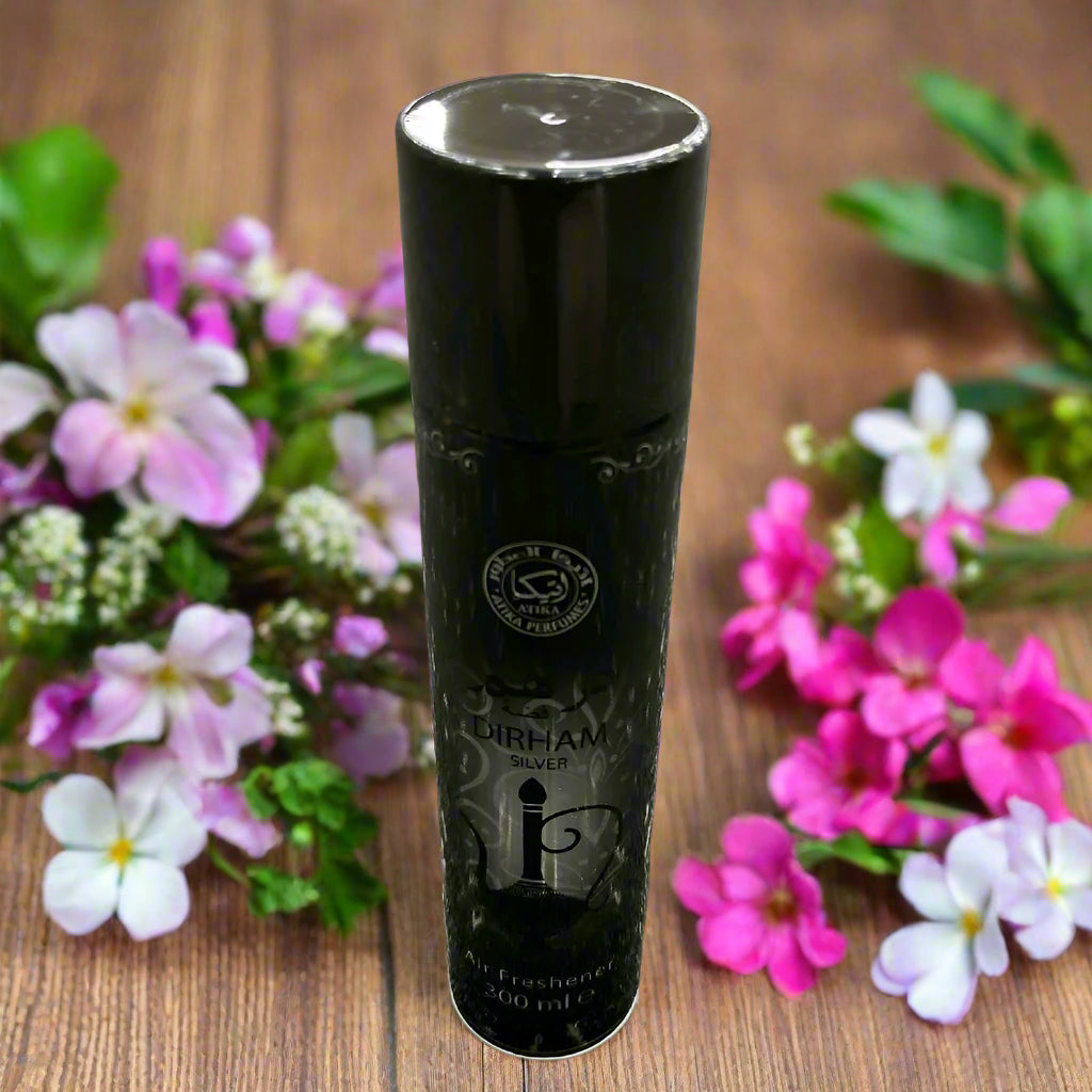Black cylindrical bottle with branding on a textured gray surface