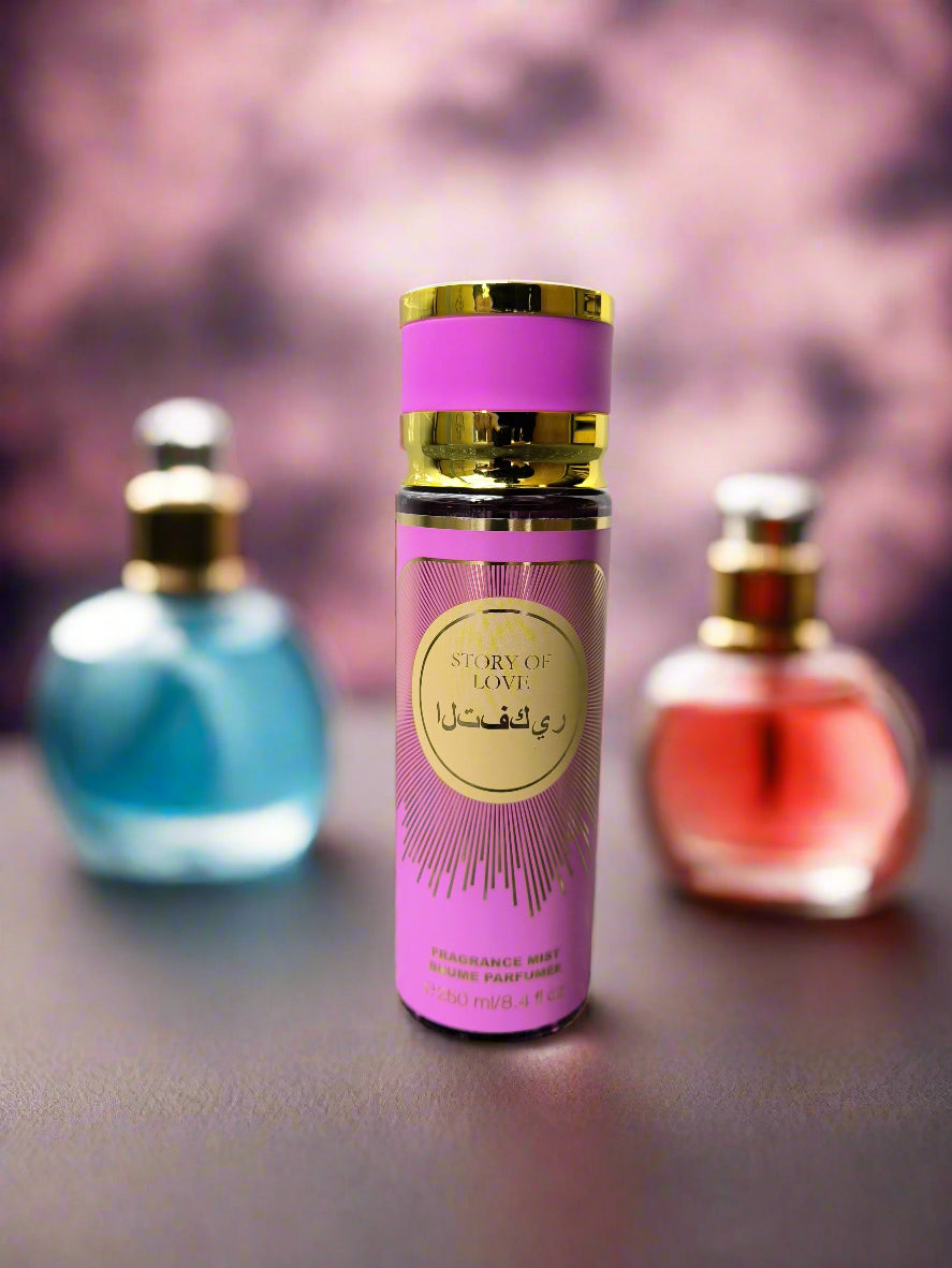 Perfume bottle with pink and gold design on a gray surface