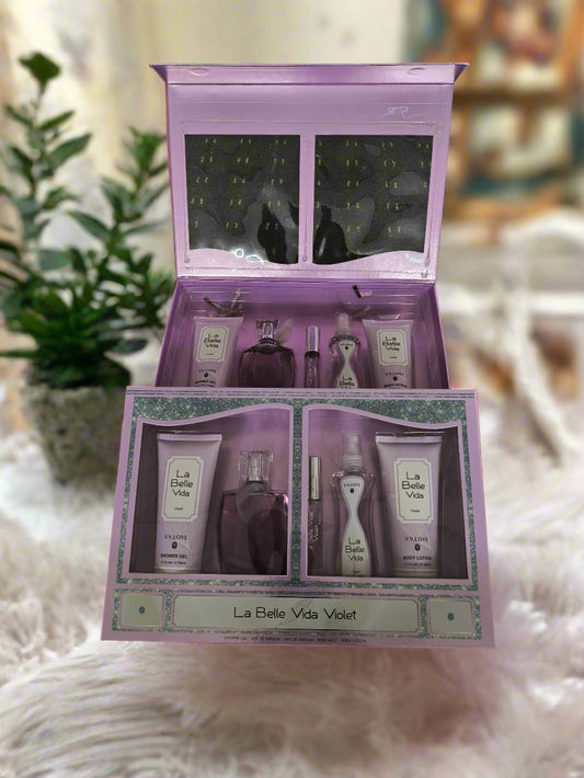 Cosmetic set with 'La Belle Vida Violet' branding on a black textured background