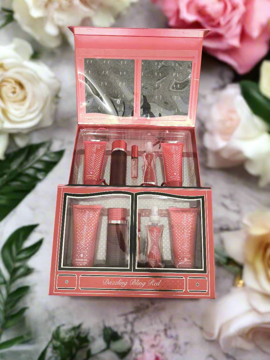Red cosmetic set with multiple products in a box on a textured black surface