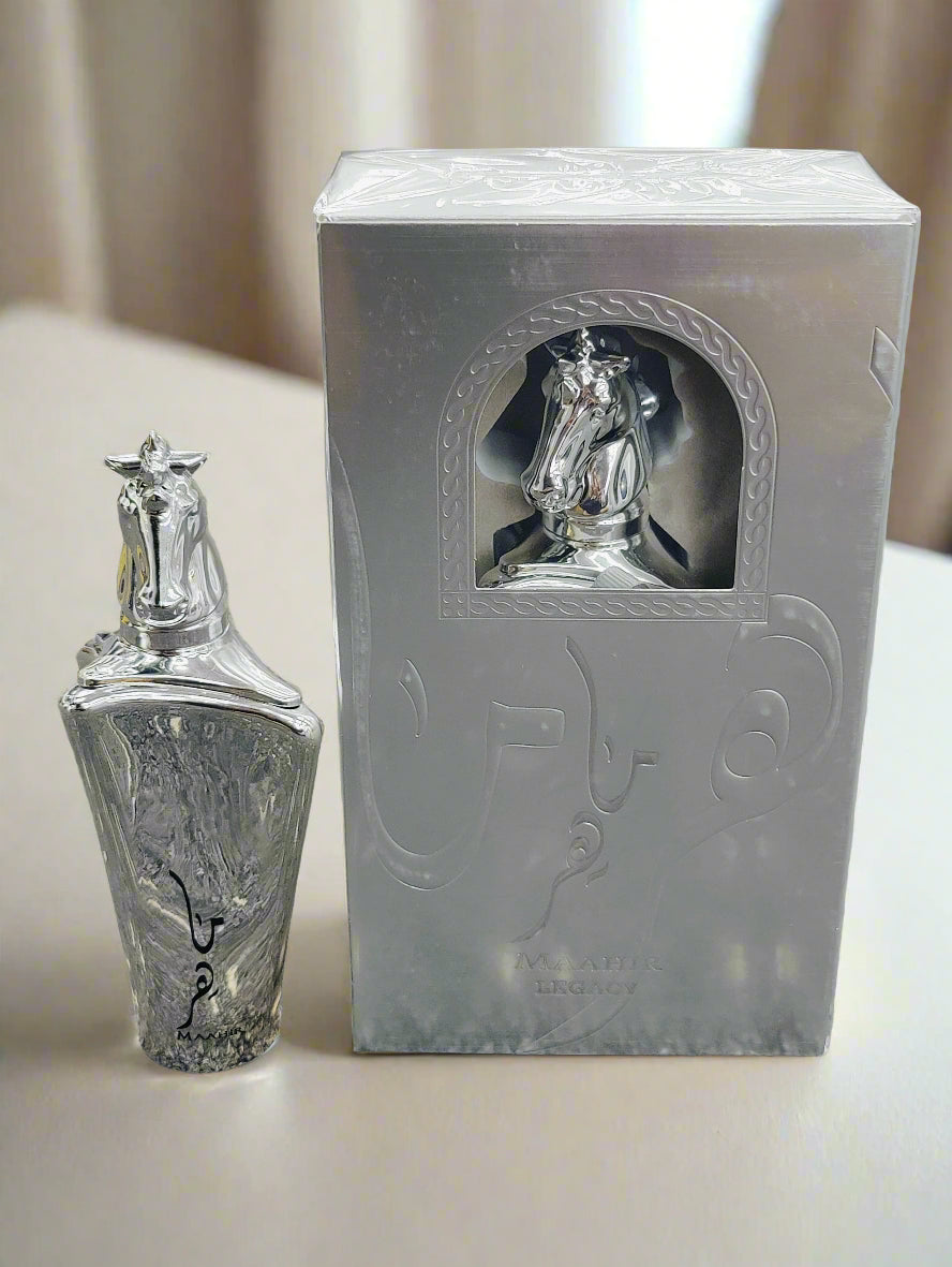 Silver bottle and its packaging on a textured surface