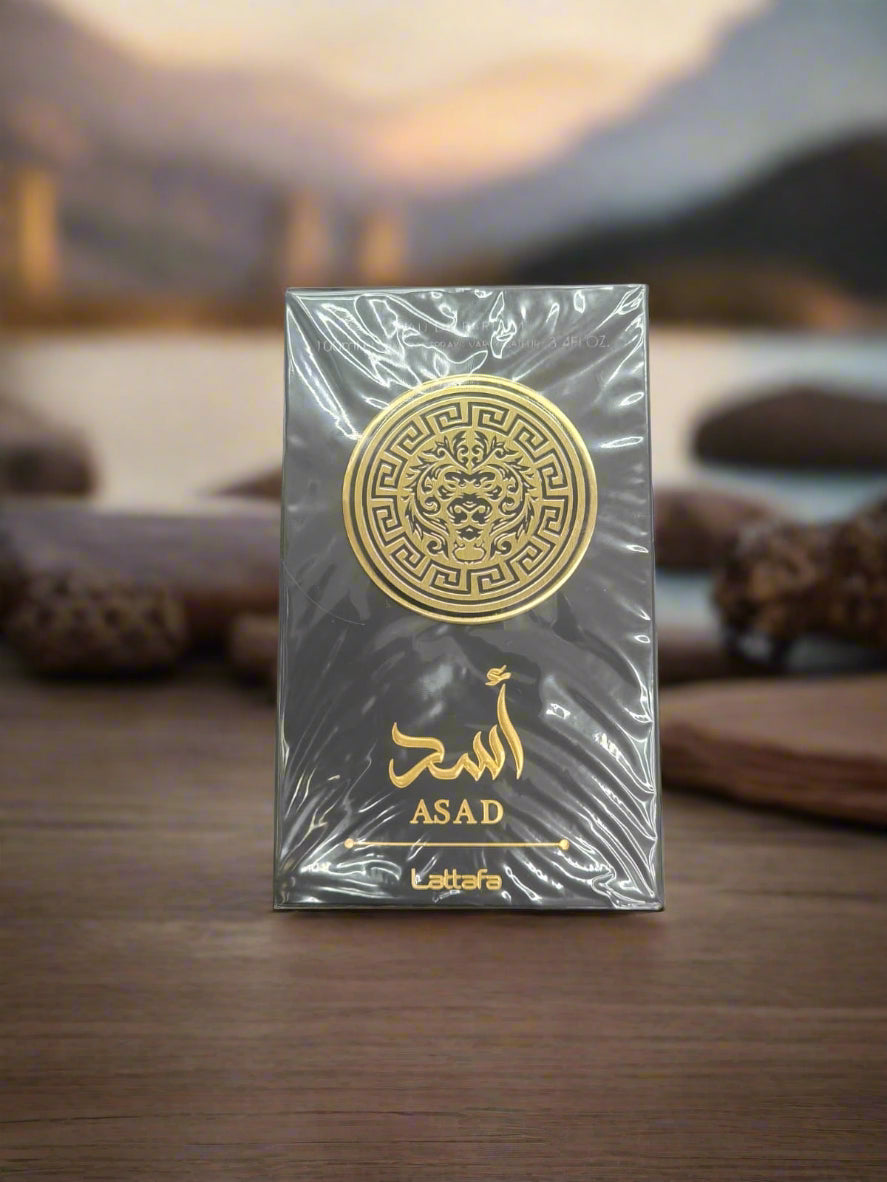 Black and gold packaging with 'Asad' branding on a textured surface