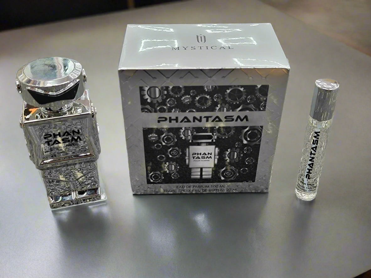 Shan Tasm and Phantasm perfume bottles with packaging on a textured surface