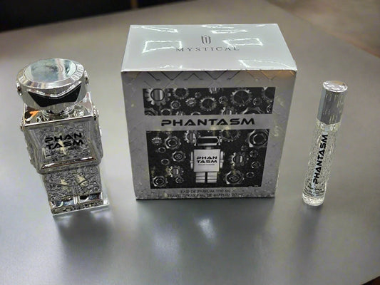 Shan Tasm and Phantasm perfume bottles with packaging on a textured surface
