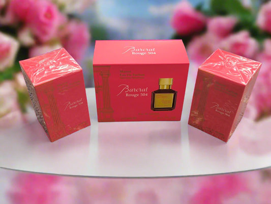 Three red boxes with a Barcel perfume bottle on a textured surface