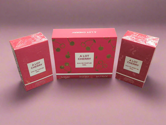 Three 'A Lot Cherry' perfume boxes on a textured surface