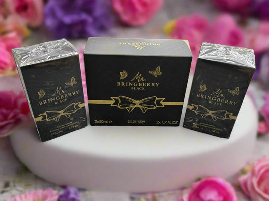Three black boxes with gold accents labeled 'Mr. Bringberry Black' on a textured gray surface.