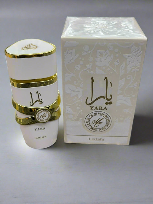 Yara perfume bottle and packaging on a textured surface
