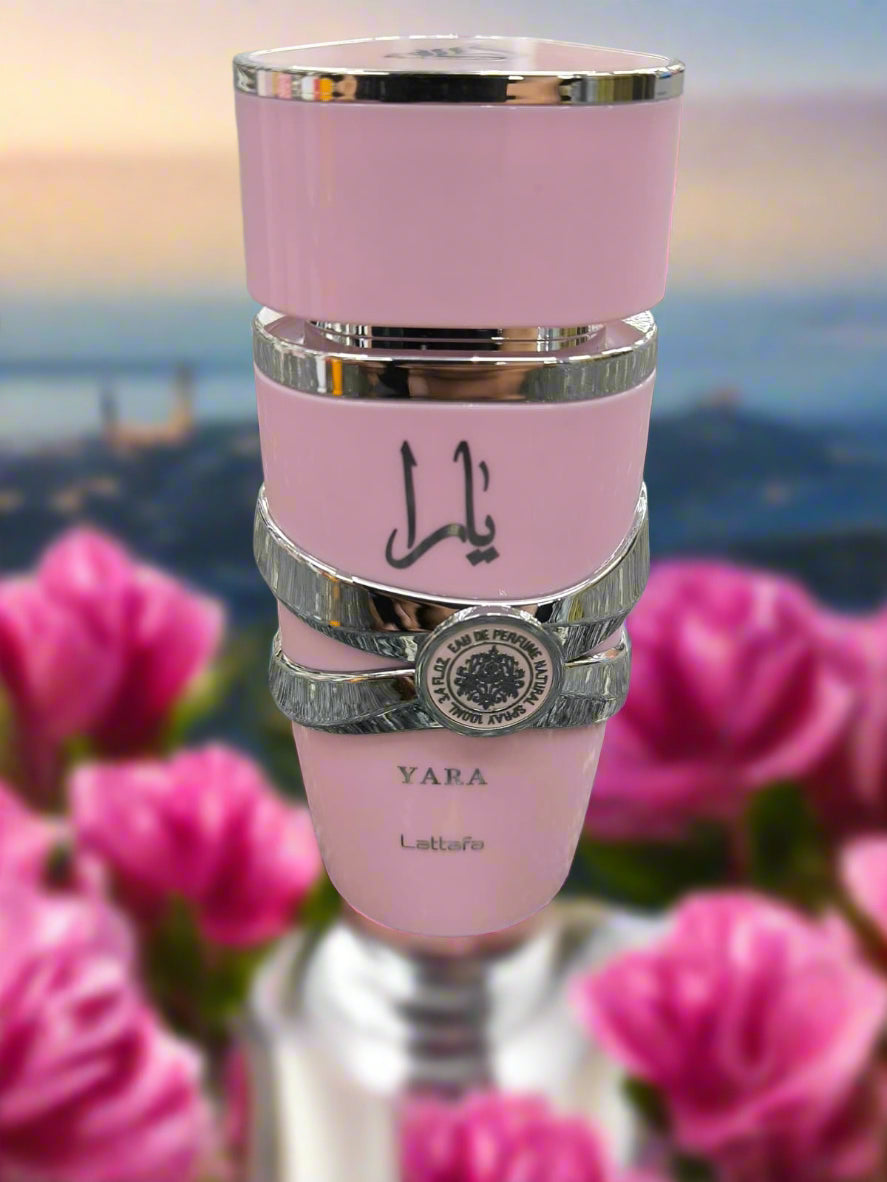Pink tumbler with silver bands and 'Yara' branding on a textured gray surface
