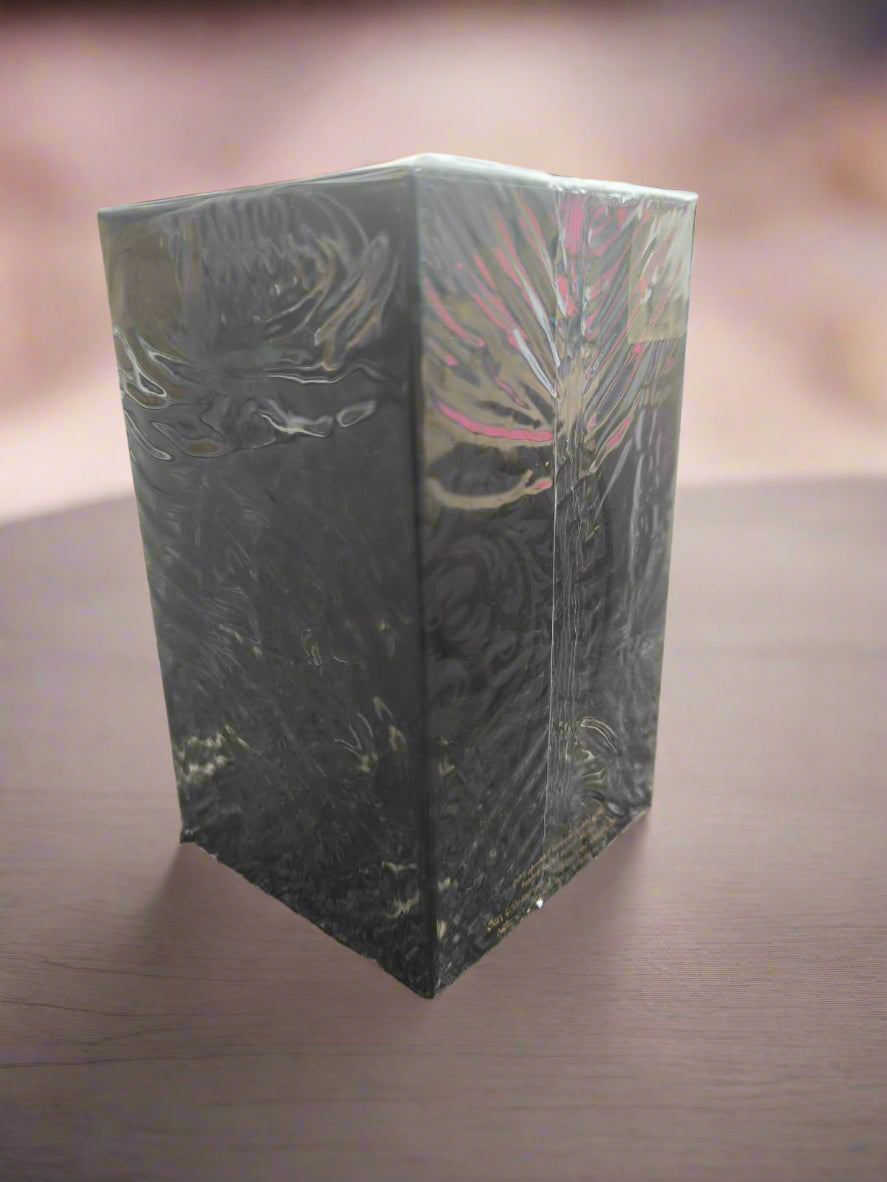 Black rectangular object with floral patterns on a textured surface