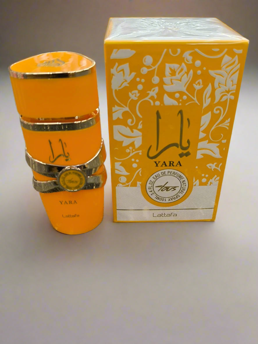 Orange perfume bottle and packaging with 'Yara' branding on a textured surface